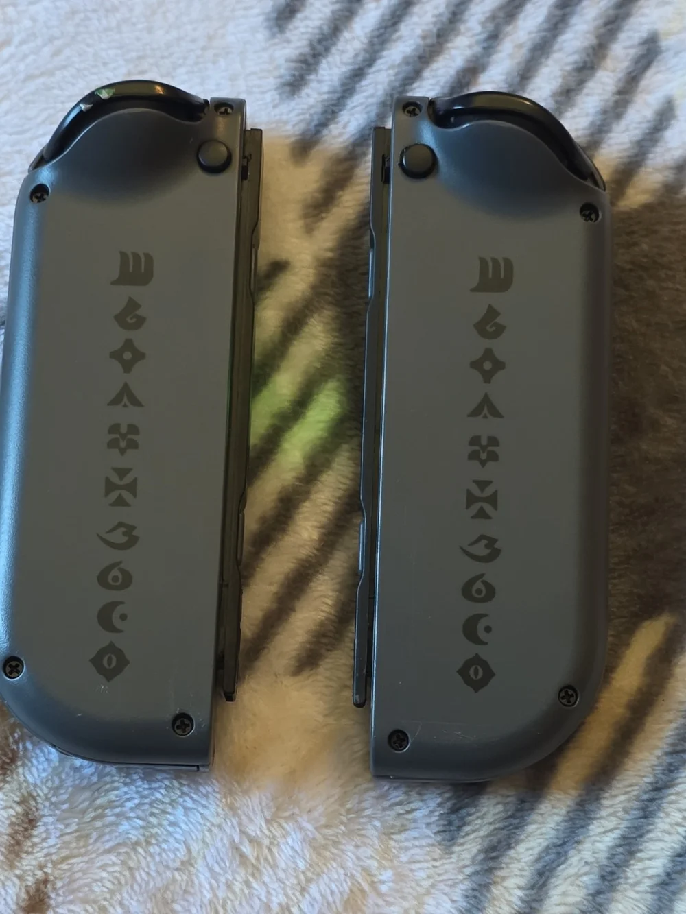 Nintendo Joy-Con Controllers in Dark Gray with Gold Accents